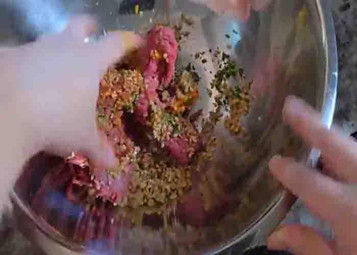 Combining the ingredients to make the meatloaf
