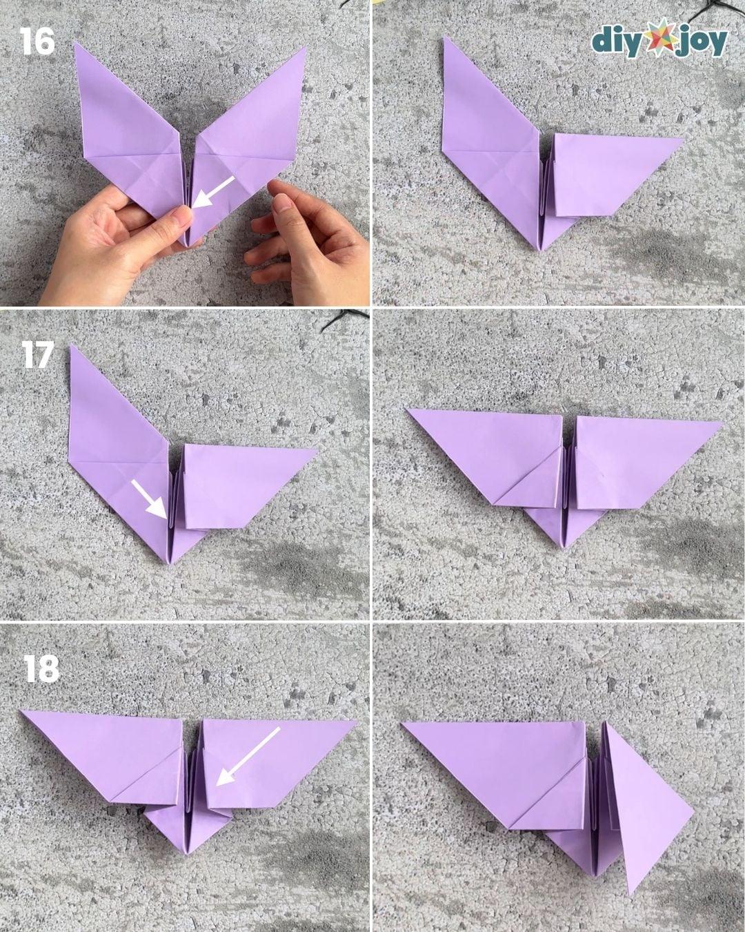 Origami bat step 6, folding the tip down to shape the body, a simple spooky-season paper folding craft for kids.