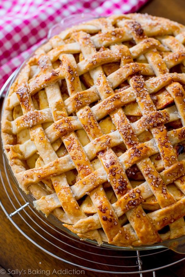 Salted caramel apple pie with a lattice crust over cinnamon apples and caramel sauce bubbling through