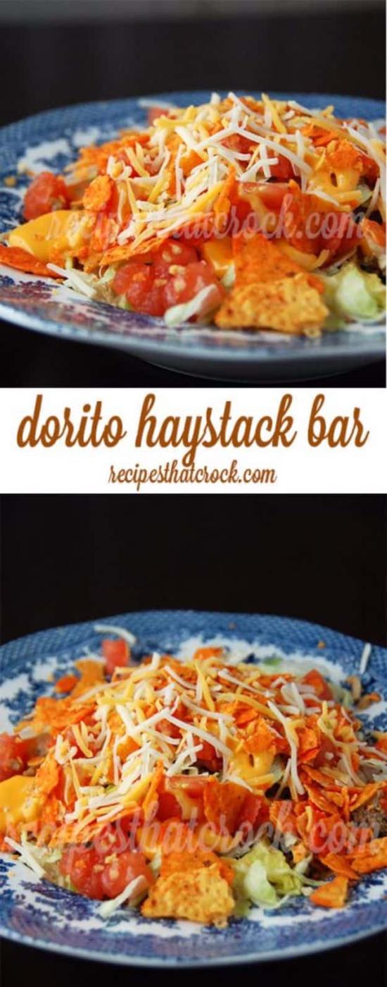 Dorito haystack bar plated up with rice, ground beef, cheese sauce, lettuce, diced tomato and nacho chips