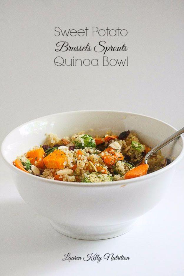 Sweet potato and brussels sprouts quinoa bowl with sliced almonds and roasted vegetables in a wide bowl