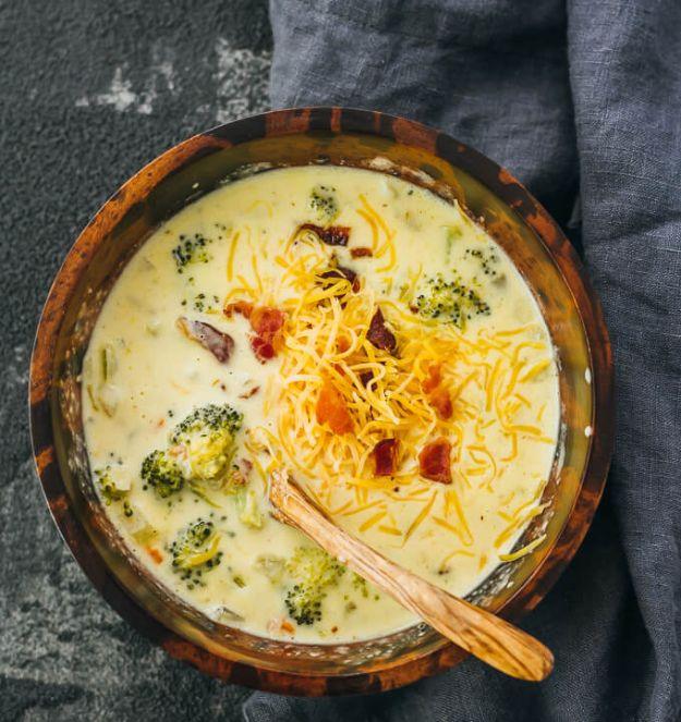 Creamy broccoli cheddar soup simmered in a dutch oven with bacon, carrots and celery until it thickens
