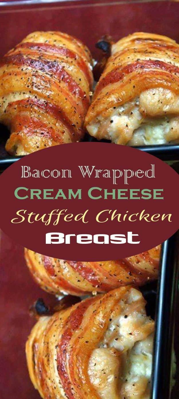 Bacon wrapped cream cheese stuffed chicken breasts on a dark tray, bacon crisped and pale filling showing at the end