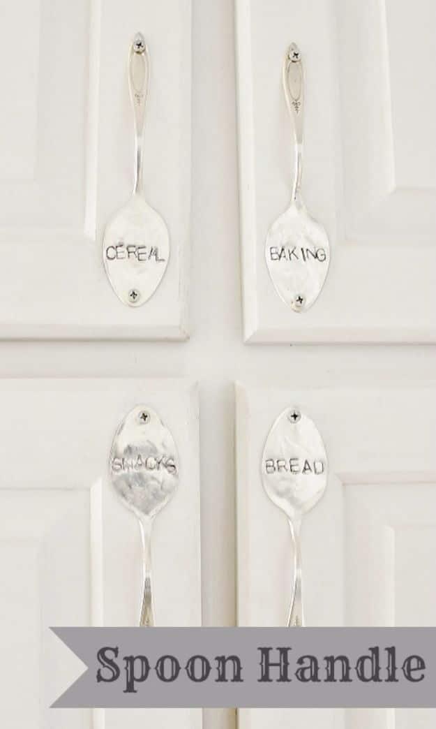 Four flattened spoons stamped Cereal, Baking, Snacks and Bread on white cabinet doors, under a typeset banner