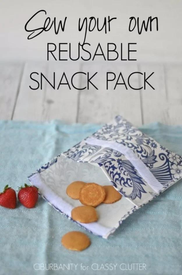 Lined snack bags in cheerful cotton prints with velcro closures, opened to show the wipeable lining, on a kitchen counter