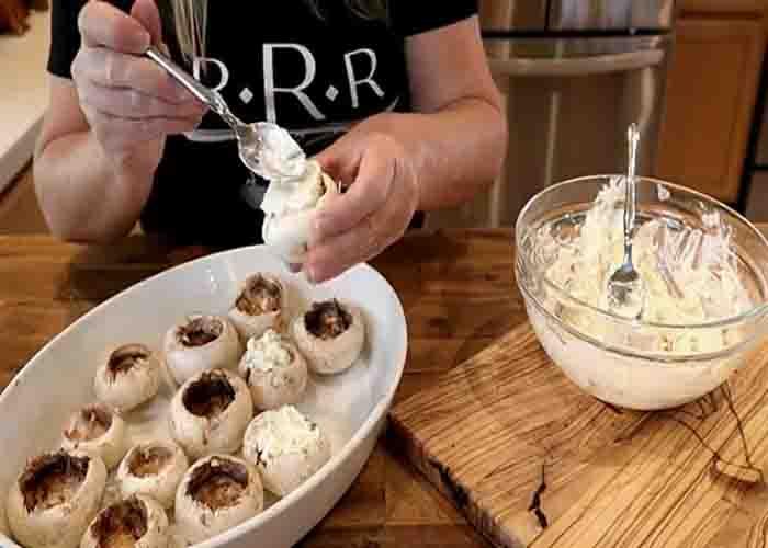 Stuffing the mushrooms with cheese mixture