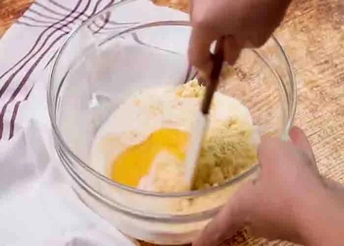 Making the cornbread base of the taco bake casserole
