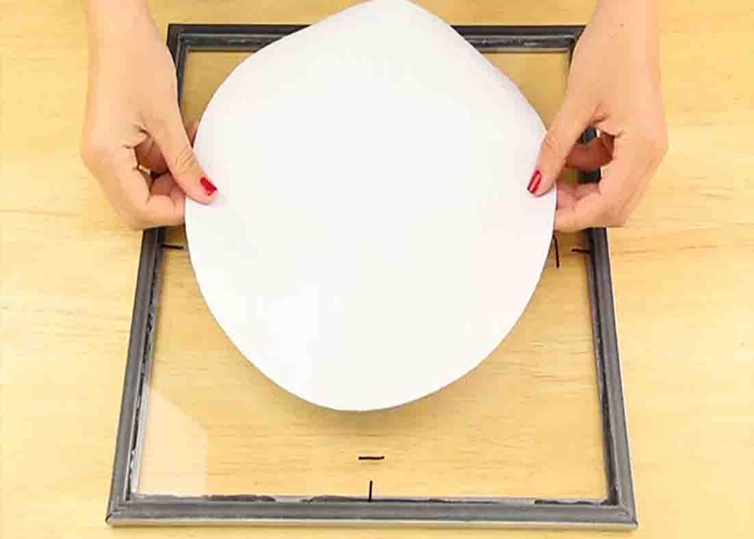 Attaching the print on the frame glass