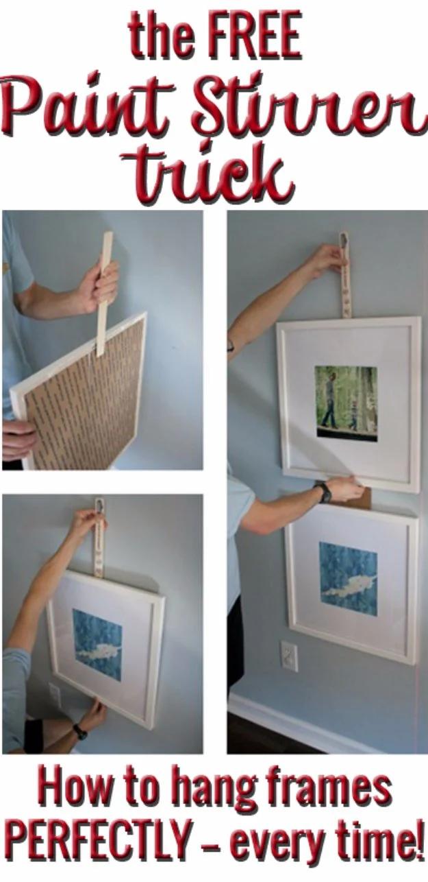 Four panel graphic showing hands holding a paint stirrer against white frames to mark nail positions on a wall