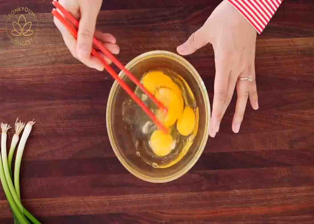 Beating the eggs for the egg fried rice recipe