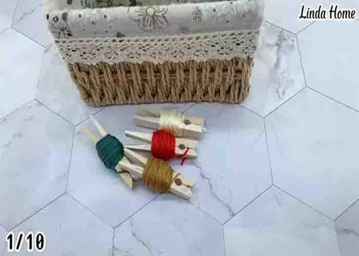 Rolling the cross-stitching yarn to a clothespin