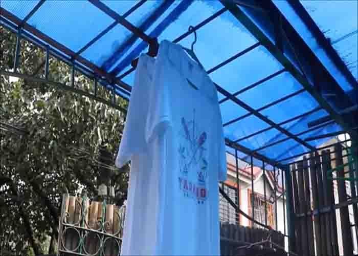 Hanging the clothes after hand washing them