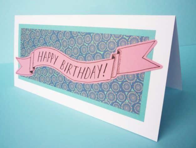 Patterned paper banner card cut and layered for a festive bunting themed birthday message on front for the whole family