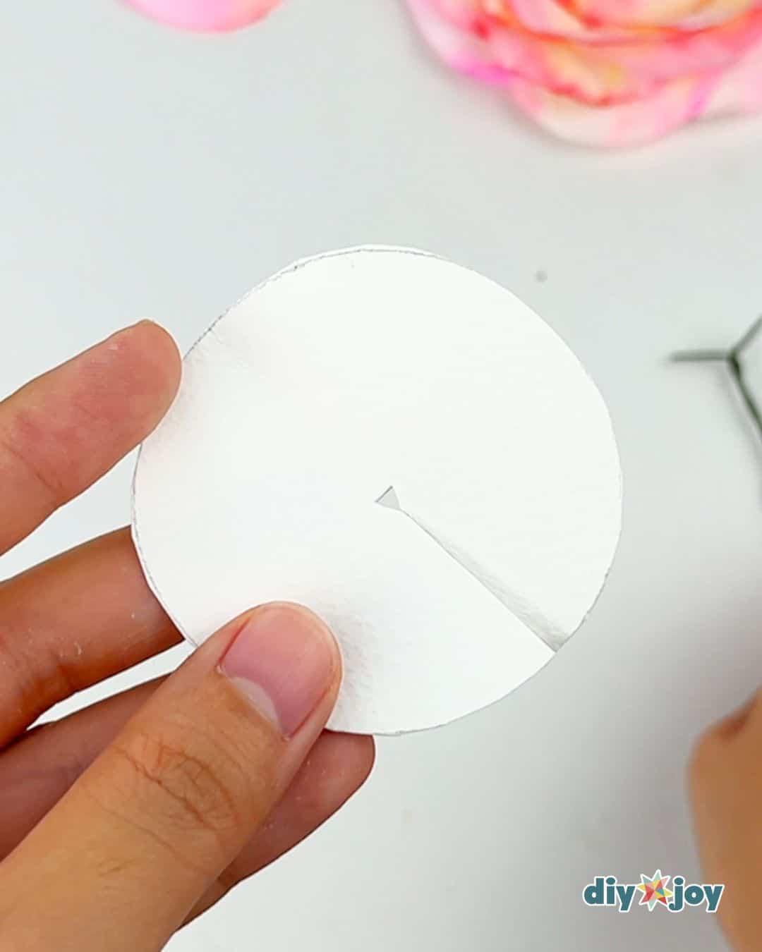 Recycled crafts idea using toilet paper and a paper cup as a mold to make handmade paper flowers at home