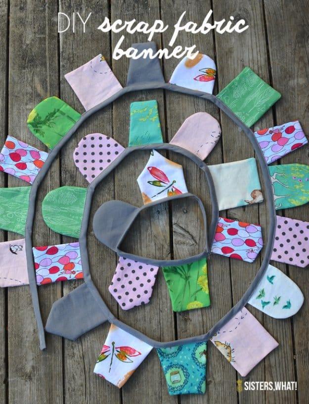 Fabric scrap banner with rounded and square flags in woodland prints and grey, coiled on weathered decking