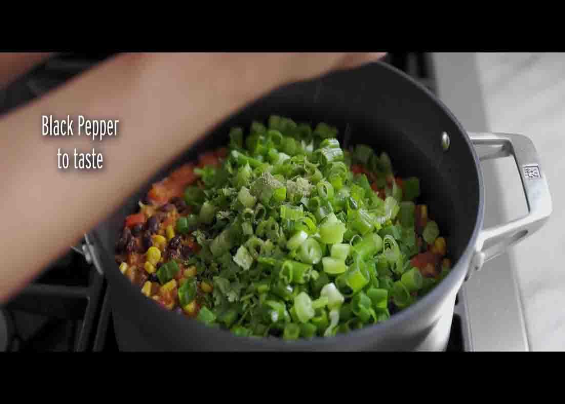 Adding the garnish for the rice and beans recipe