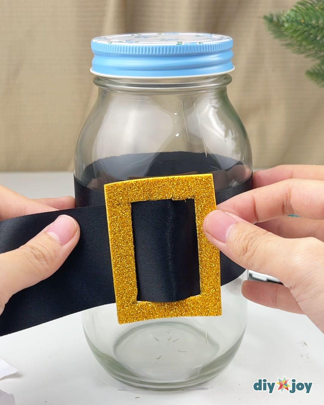 Homemade Santa Chocolate Jar — placing the belt