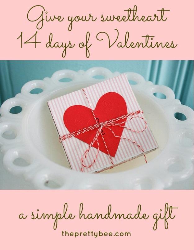 14 Days of Valentines cards, a bundle of small folded scrapbook paper cards tied together with twine