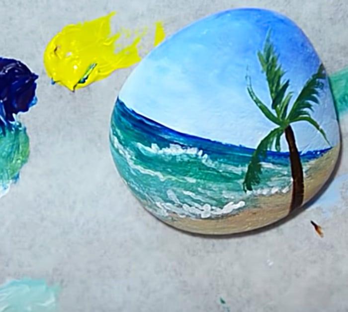 Small rock with hand painted beach scene