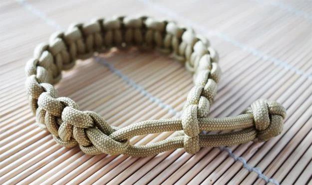 Khaki and tan Mad Max style cobra stitch paracord bracelet closed with an adjustable loop and knot, no buckle