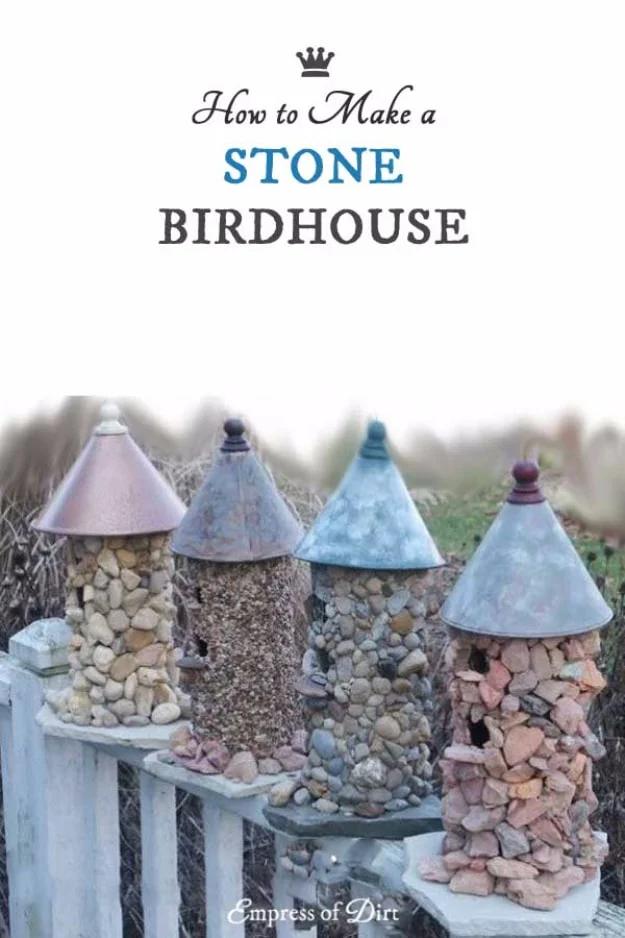 Four stone covered birdhouses with metal funnel roofs on a fence, under a typeset title reading stone birdhouse