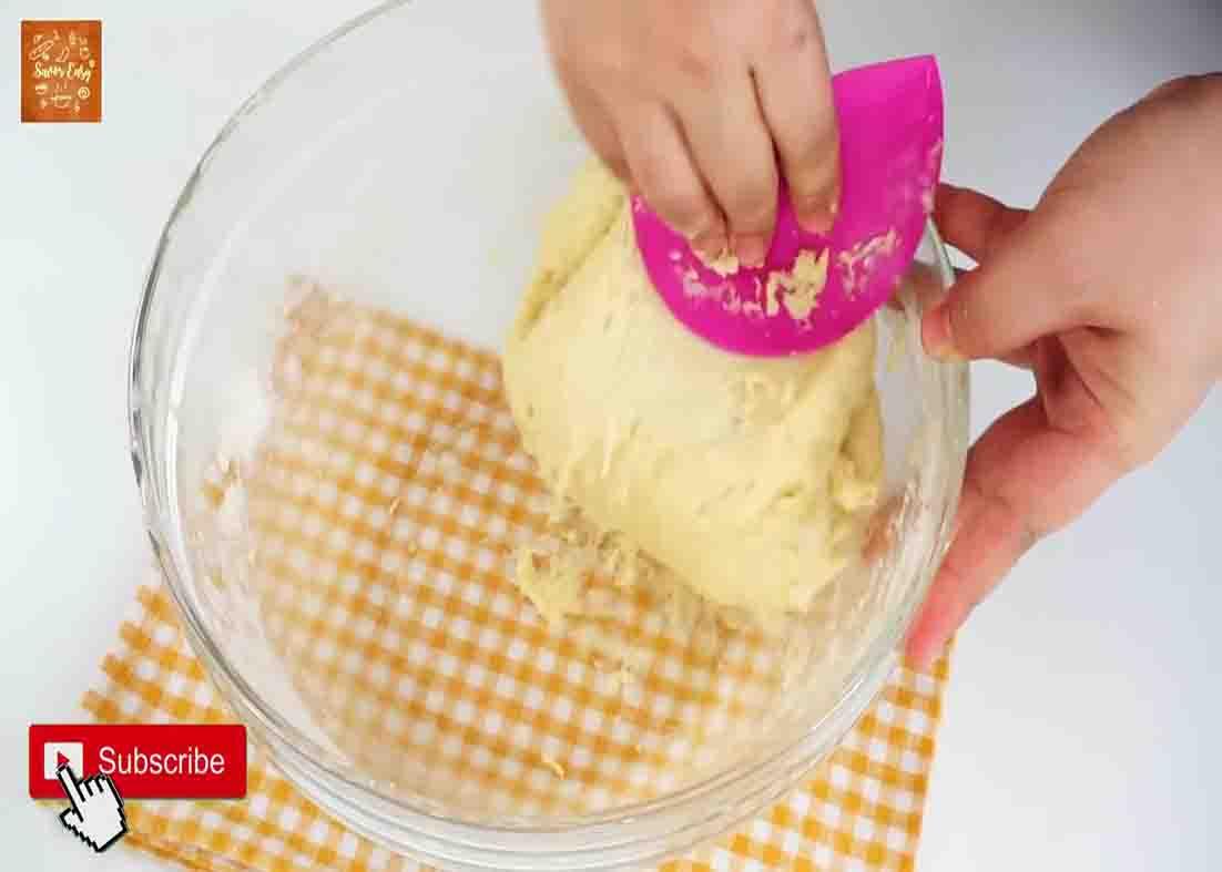 Mixing the ingredients to make the buttery soft buns dough