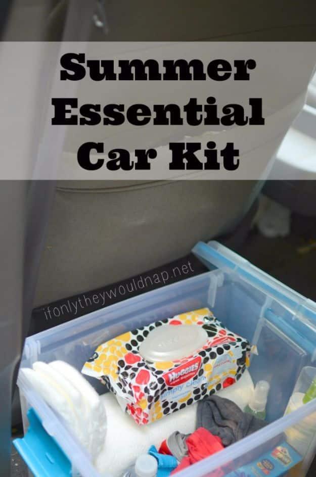 Summer essential car kit in a clear lidded bin of wipes, folded spare clothes and a patterned pack of baby wipes