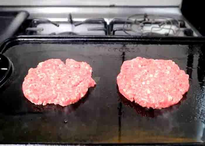 Grilling the patties for the whataburger patty melt