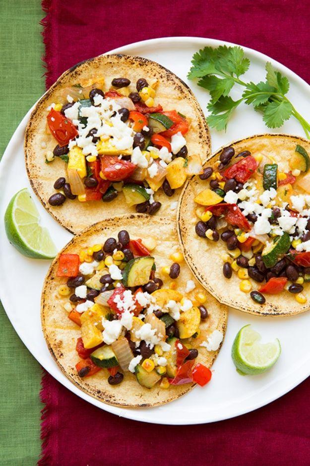 Roasted veggie and black bean tacos assembled for a colorful meatless taco night dinner for the whole family