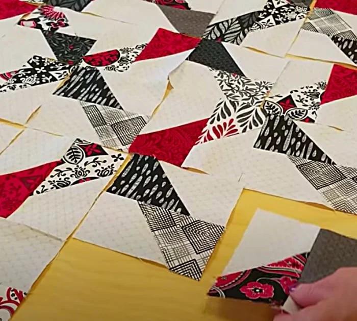 Make a jagged x quilt with a pack of layer cake fabric pieces