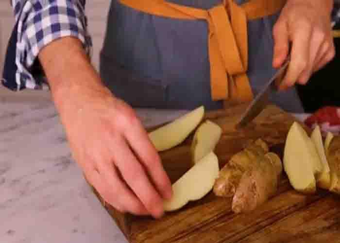 Chopping the potatoes into wedges