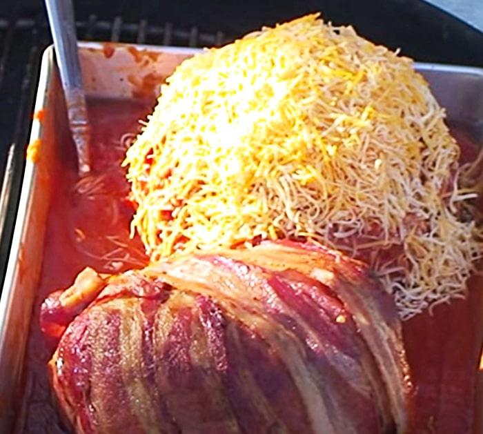 Big meatballs made on the barbecue pit with ground beef and bacon