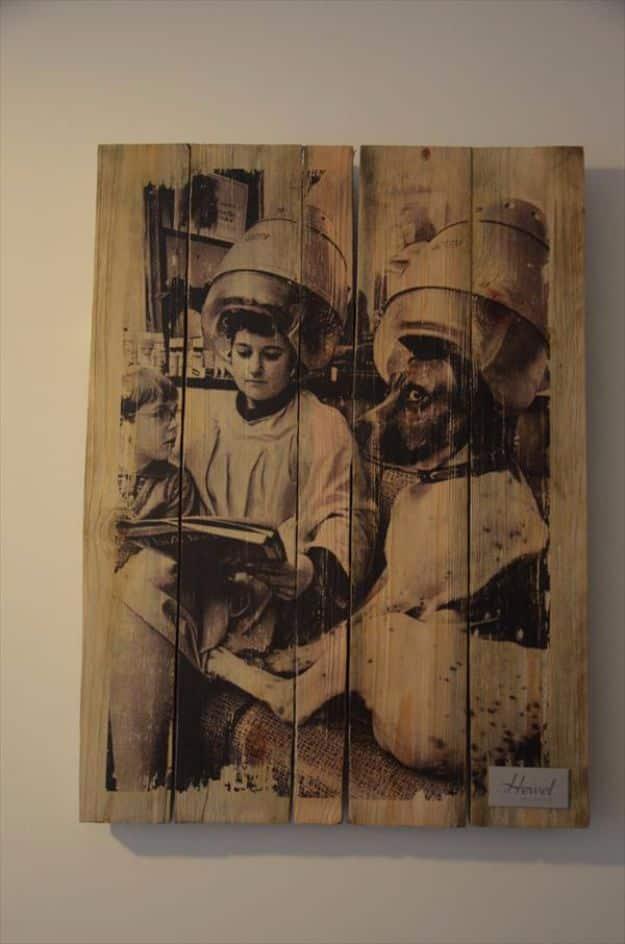 Pallet wood panel with a sepia vintage photograph of two women under salon hair dryers transferred across the boards