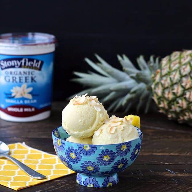 Pineapple frozen yogurt blended into creamy soft serve in a bowl, an easy five minute healthy frozen treat