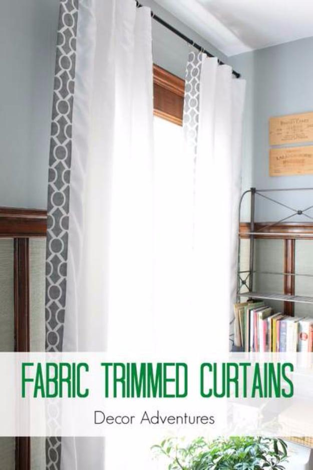 Typeset graphic reading Fabric Trimmed Curtains over white panels with a grey geometric band down the edge