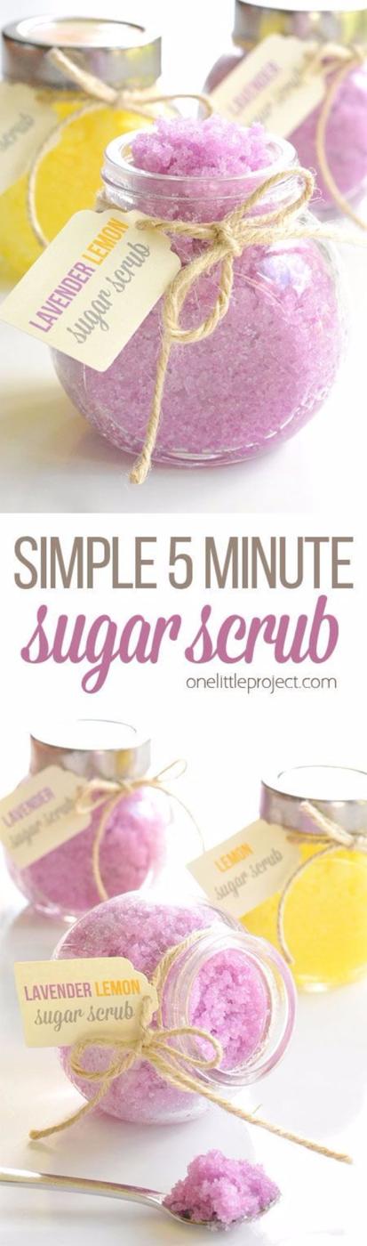 Homemade sugar scrub in round glass jars, one lavender purple and one pale yellow, kraft tags on twine