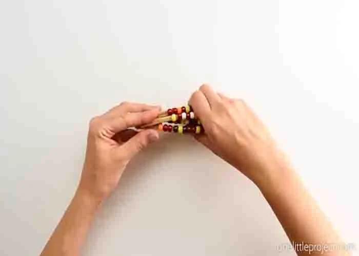 Finishing the beaded pipe cleaner corn DIY