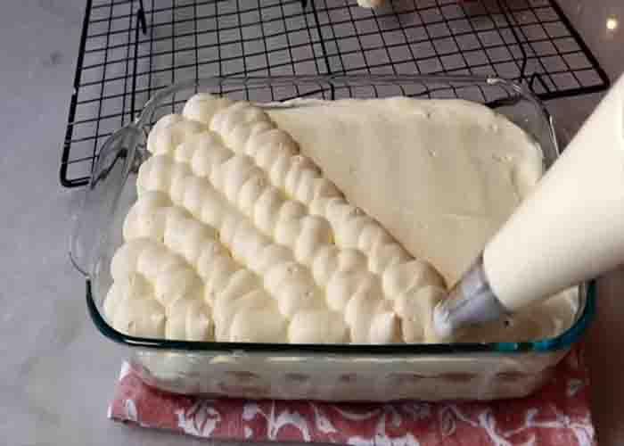 Adding the mascarpone cream layer in the tiramisu