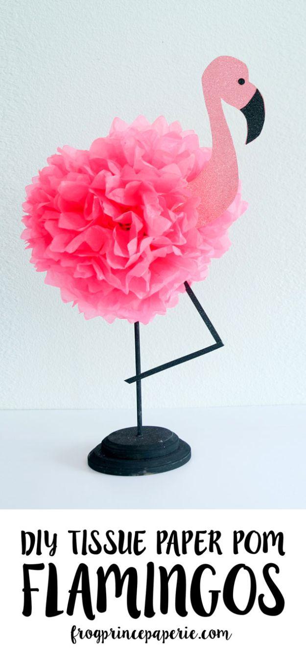 Tissue paper flamingo, a bright pink tissue pom body with a glitter cardstock head and black legs on a round base