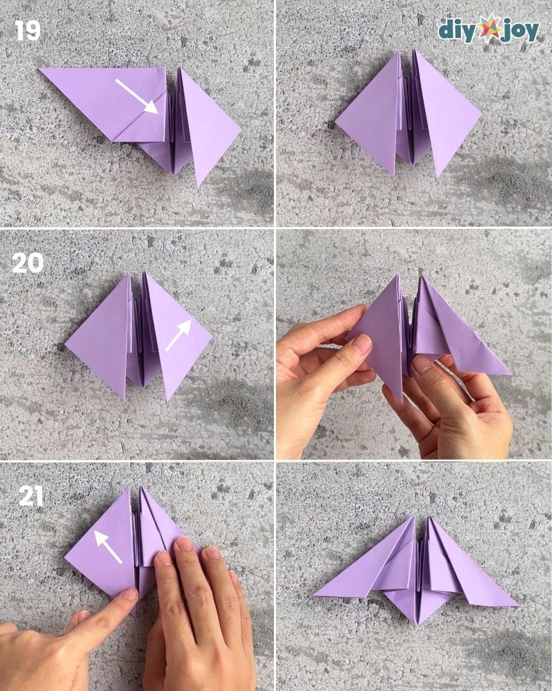 How to make an origami bat, step 7 creasing the top edge, an easy paper craft for kids with no scissors.