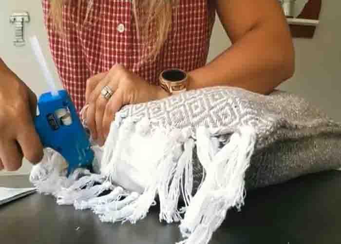 Gluing the DIY Dollar Tree pillow closed