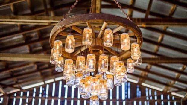 Wagon Wheel Chandelier, a popular choice on this list and a pretty statement piece for a dining room or bedroom