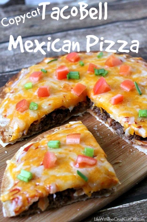 Copycat Taco Bell Mexican pizza with refried beans, seasoned beef, melted cheese and diced fresh tomatoes