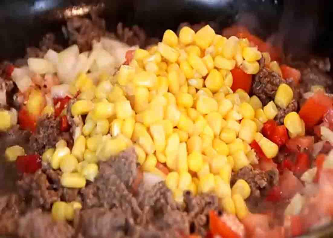 Cooking the meat filling for the mashed potato bites