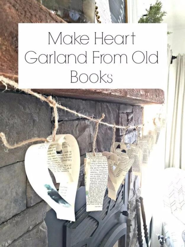 Heart garland graphic showing paper hearts cut from old books and strung on twine across a stone fireplace
