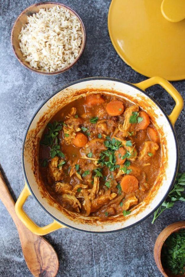 Moroccan chicken stew with carrots and dates in a spiced tomato broth, topped with fresh parsley for a fast family dinner