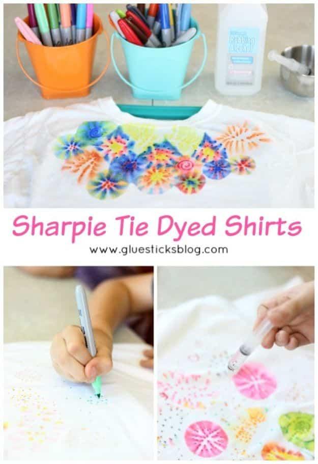 White t-shirt covered in colorful sharpie tie dye bursts made by dripping rubbing alcohol on ink dots
