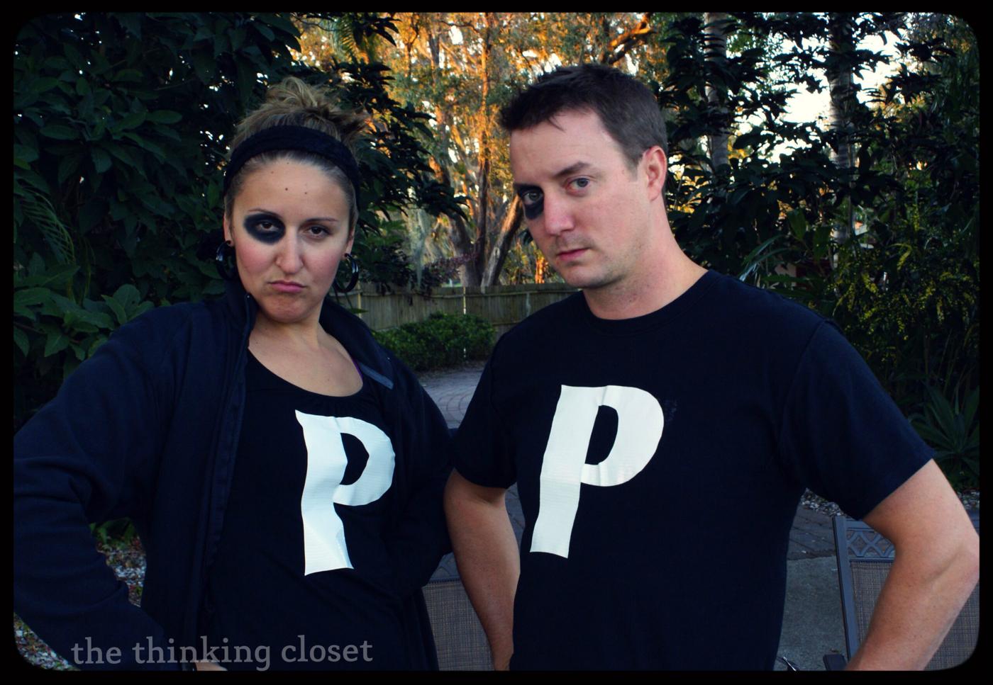 Black Eyed Ps pun couples costume with black shirts, large duct tape letter P shapes and smudged dark eyes