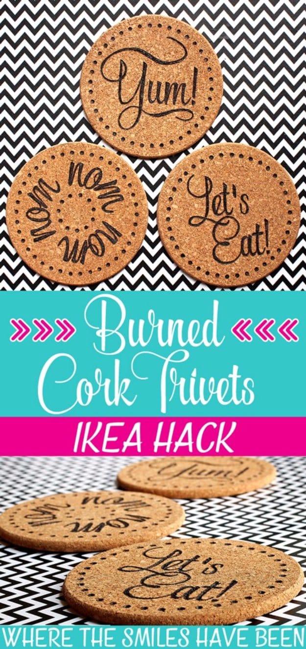 A round cork trivet with a geometric design burned into its surface in fine brown lines, resting on a white kitchen counter.
