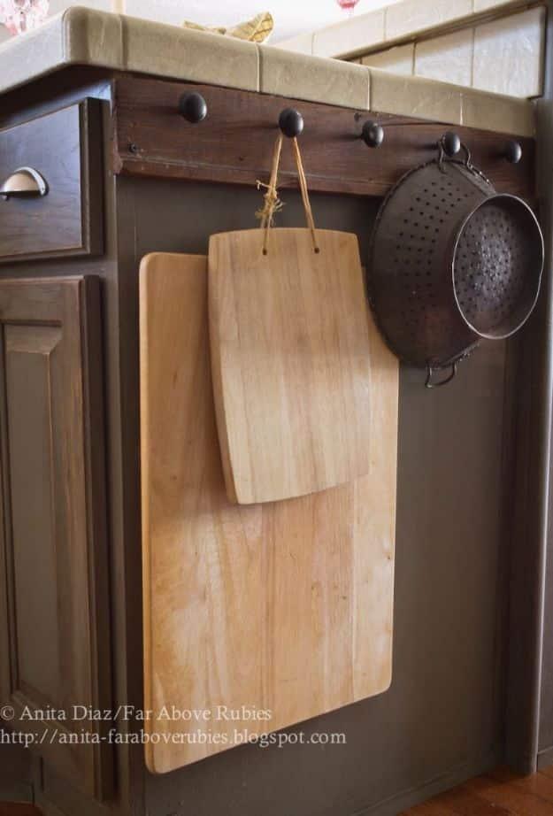 Hang Cooking Essentials, a practical way to make old cabinets feel new and a creative storage idea for a busy kitchen